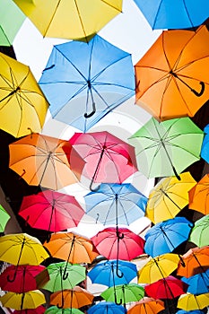 Many colorful umbrellas against the sky in city settings. Kosice, Slovakia