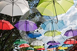 Many colorful umbrellas hanging to decoration outdoor