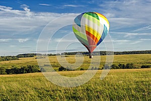 Many hot air balloons in the sky at blue sky with clouds background