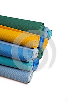 Many colorfull yoga mats as a background