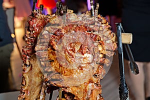 Many Cooking Traditional Turkish roasting lamb barbecues.Roasted meat over an open fire, cooked in a special way