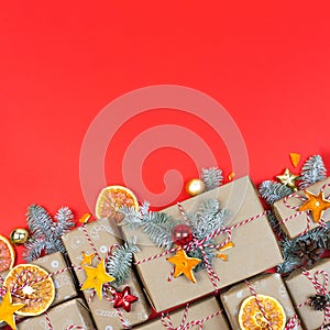 Many craft gift boxes on red background. Christmas holiday package banner template. New year zero waste still life