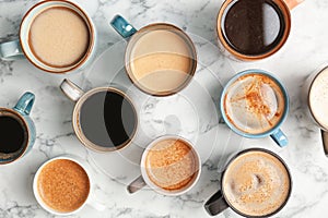 Many cups of different aromatic hot coffee