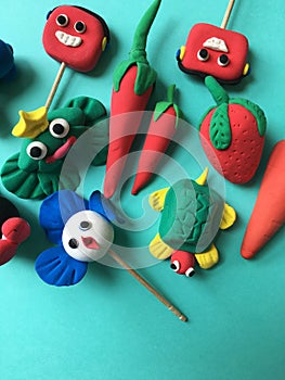 Many cute figures made with soft clay in a play school.