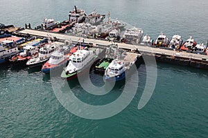 Many cutters at its mooring in port.