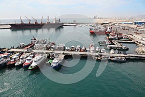 Many cutters at its mooring in port photo