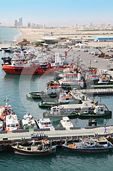 Many cutters at its mooring in port.