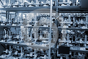 Many 3D printers printing an object. 3D printers simultaneously printing model