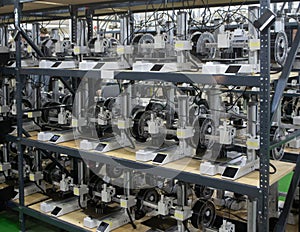 Many 3D printers printing an object. 3D printers simultaneously printing model