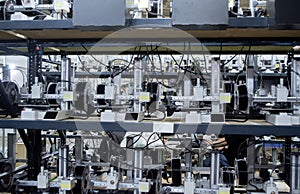 Many 3D printers printing an object. 3D printers simultaneously printing model