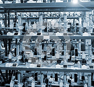 Many 3D printers printing an object. 3D printers simultaneously printing model