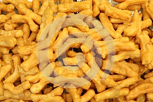 Many deep fried dough stick as background view on top