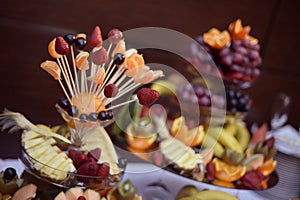 Many delicious fruits on sticks