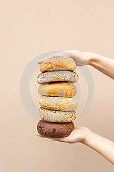 Many different bagels in a stack