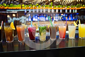 Many different cocktails prepared by at the bar.