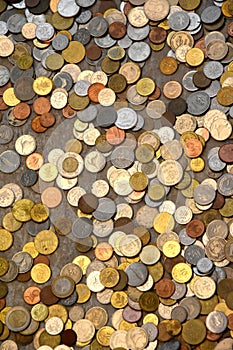 Many different coins at the ground