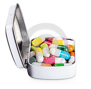 Many different colored pills isolated on white