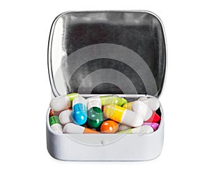 Many different colored pills isolated on white