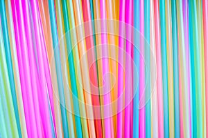 Many different colored plastic drinking straws