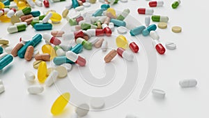 Many different colored tablets, capsules isolate on white background. Health care concept. Antibiotics inside pills