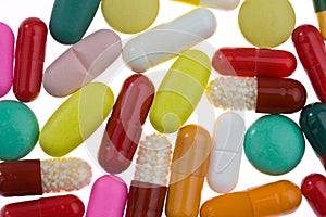Many different colored tablets and medicines
