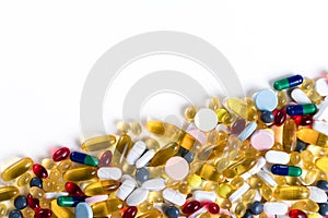 Many different colorful medication and pills on white background with copy space