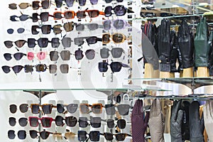 Many different colors Glasses Eyeglasses Optical Store and leather gloves on display in the market