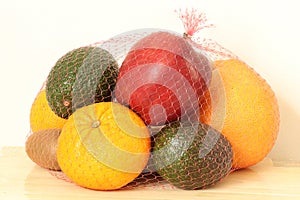Many different fruits on a light background.