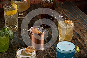 Many different multi-colored cocktails with different colors