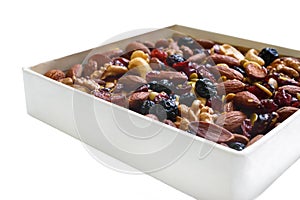 Many different nuts almonds, cashews, walnuts, dried berries blueberries, cranberries isolated