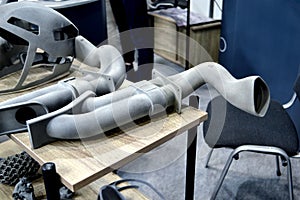 Many different objects printed on 3D printer from powder polyamide.