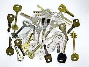 Many different old used keys on white background