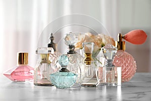 Many different perfume bottles on table