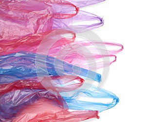 Many different plastic bags on white background