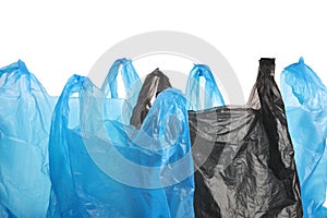 Many different plastic bags on white background