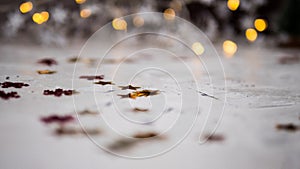 Many different plastic stars are surrounded by bokeh. The colors are multicolored and are the circular lights of the Christmas lig