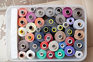Many different spools of thread top view