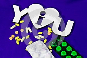 Many different tablets and thermometer