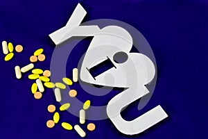 Many different tablets and thermometer