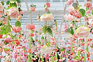 Many different type of sweet artificial flower hanging from ceiling. Beautiful Upside down flowers