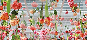 Many different type of sweet artificial flower hanging from ceiling. Beautiful Upside down flowers