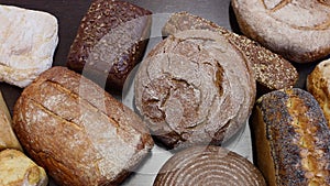 many different types of bread. Wholegrain, round, rolls and loaves