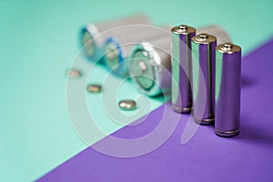 Many different types used or new battery, rechargeable accumulator, alkaline batteries on color background