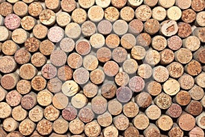 Many different used wine corks in the background