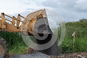 Wheel loader pour gravel pebble stone.