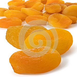 Many dried yellow color apricots fruits. Front view