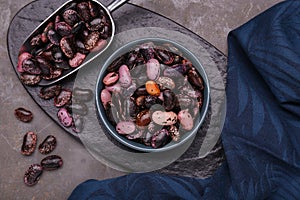 Many dry kidney beans on grey table, flat lay