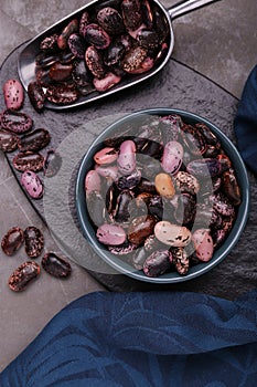 Many dry kidney beans on grey table, flat lay