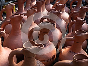 Many  earthenware jugs for wine are sold.