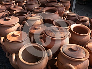 Many  earthenware jugs for wine are sold.